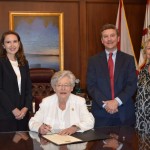 (L to R) Felicia Long, Bar Commissioner and Chair of the Alabama State Bar Lawyers in the Classroom Committee; Gov. Kay Ivey; Alabama State Bar President Bob Methvin; Alabama State Bar Interim Executive Director Ellen Brooks